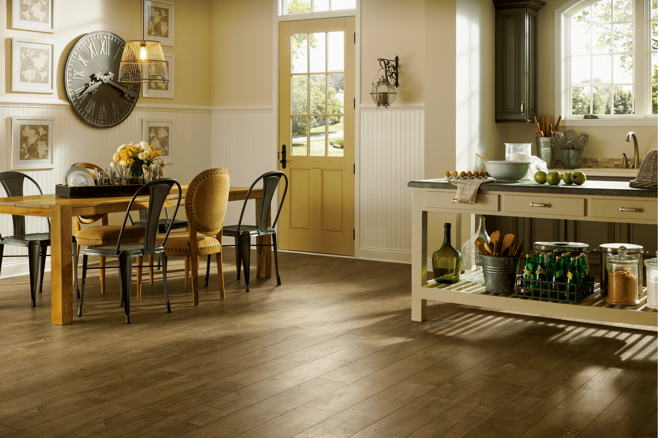 A kitchen with beautiful new hardwood flooring from Barefoot Flooring Flooring store. 