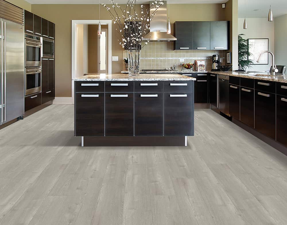 A kitchen floor with Mohawk luxury vinyl flooring.